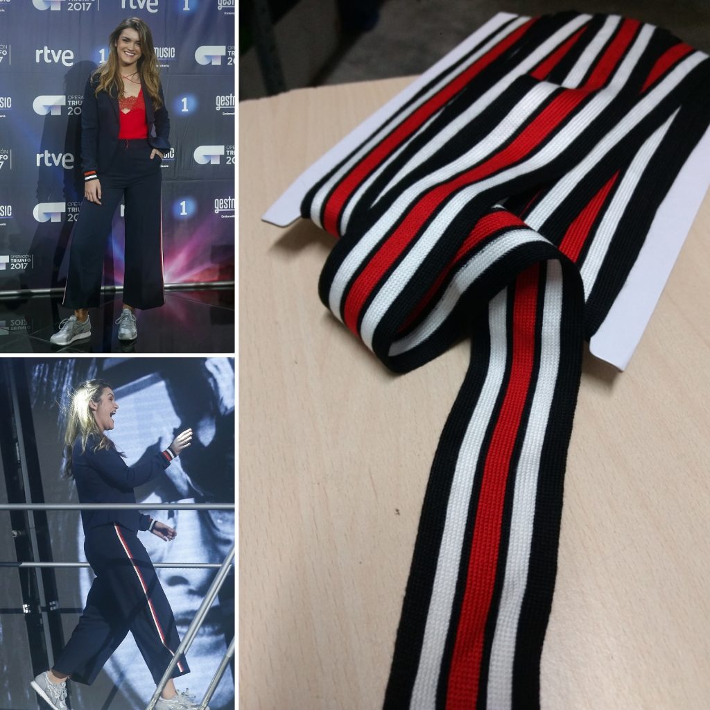 En la imagen aparecen dos imágenes de Amaia Romero con unos pantalones deportivos negros con unas cintas en los costados rojas y blancas. Además aparece una cinta igual que la que llevan sus pantalones.